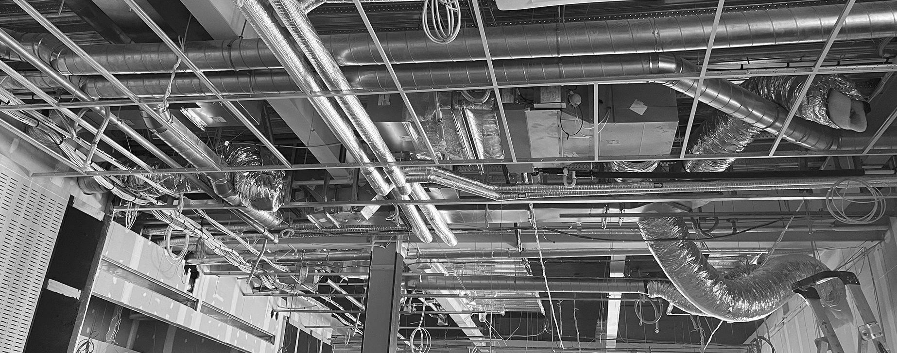Large spiral ductwork being installed