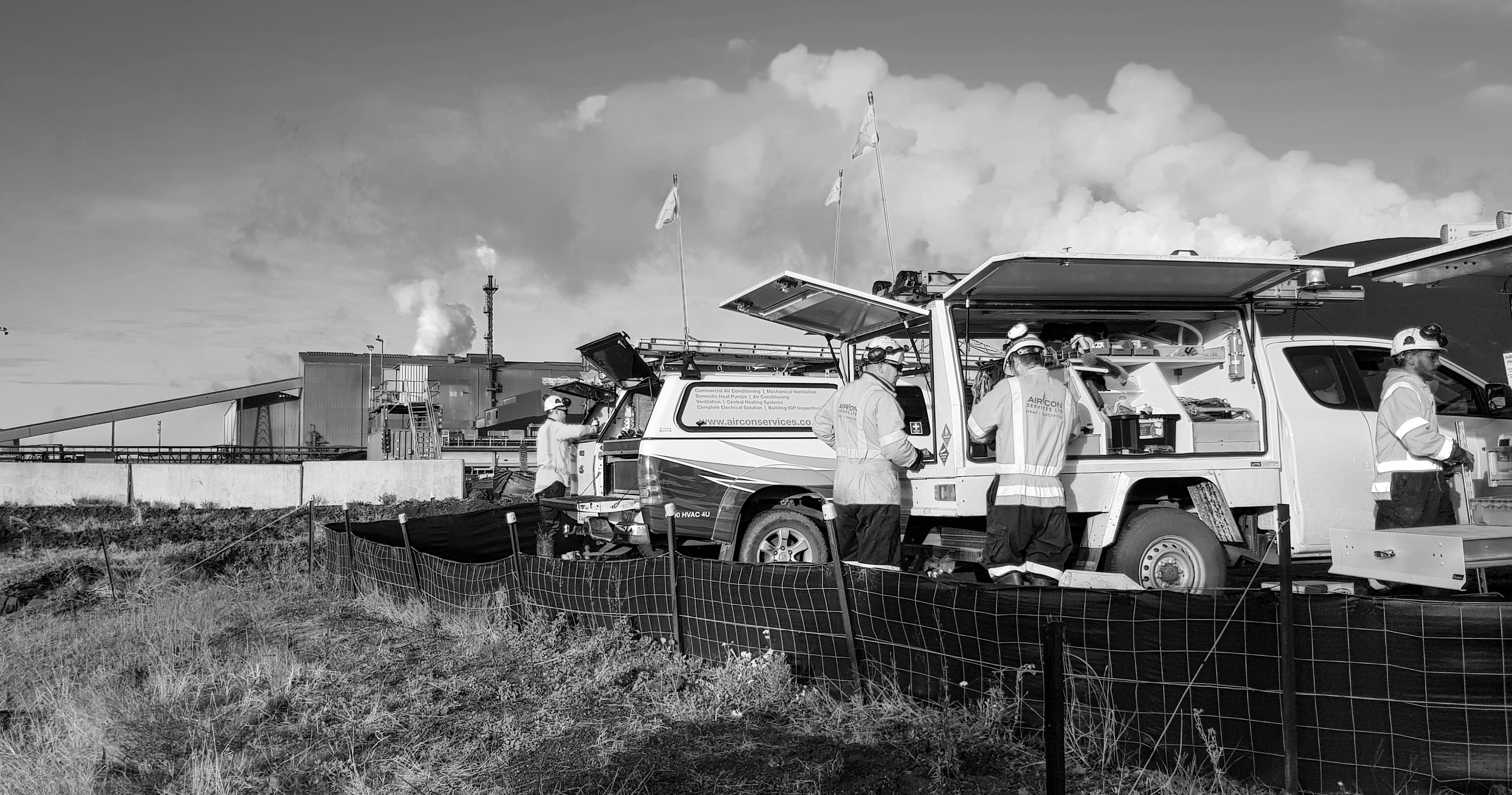 ACSL service vehicle on a site yard with heavy plant in the background