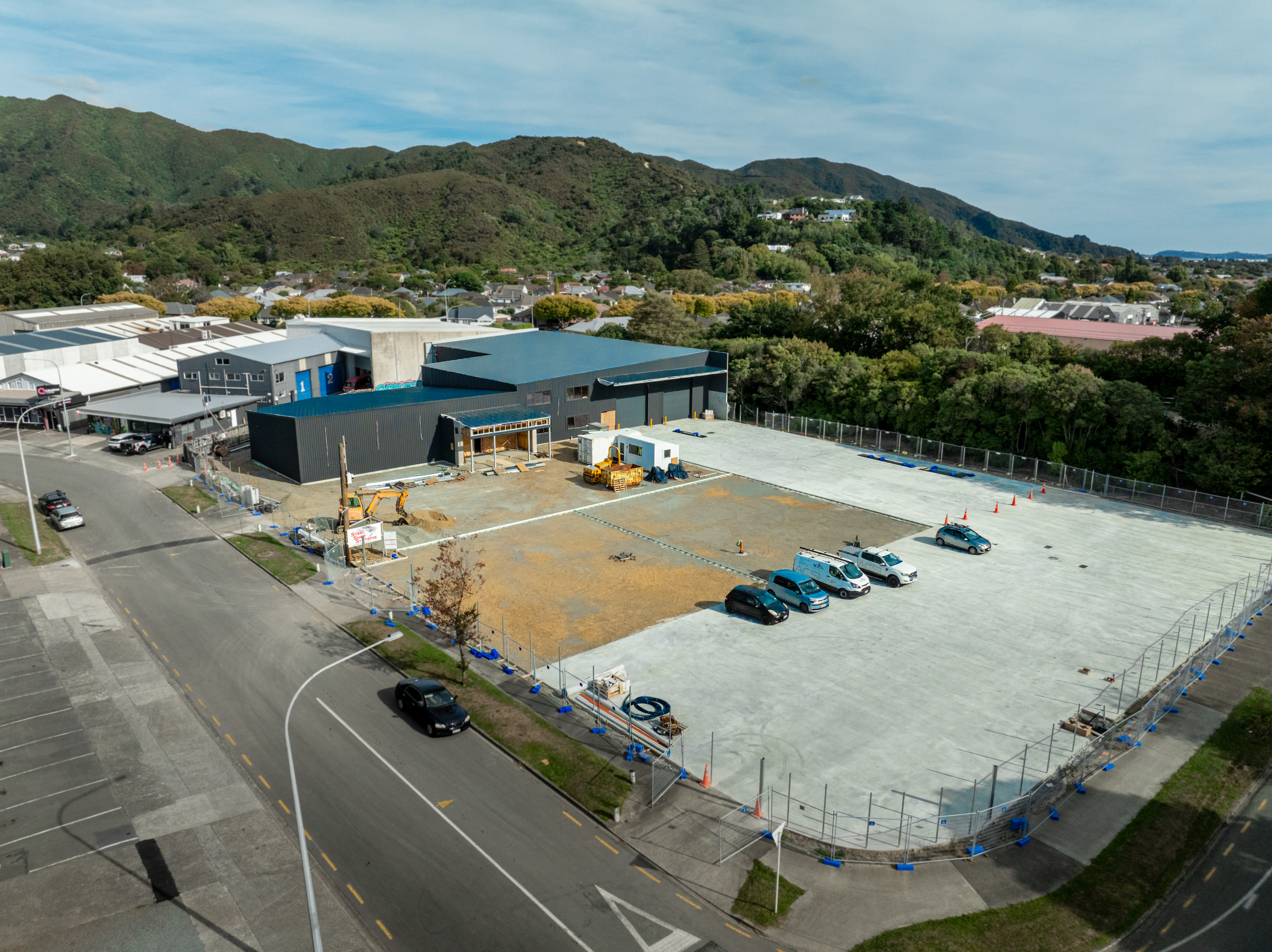 Aerial of the branch mid-build, clad shell with freshly poured yard