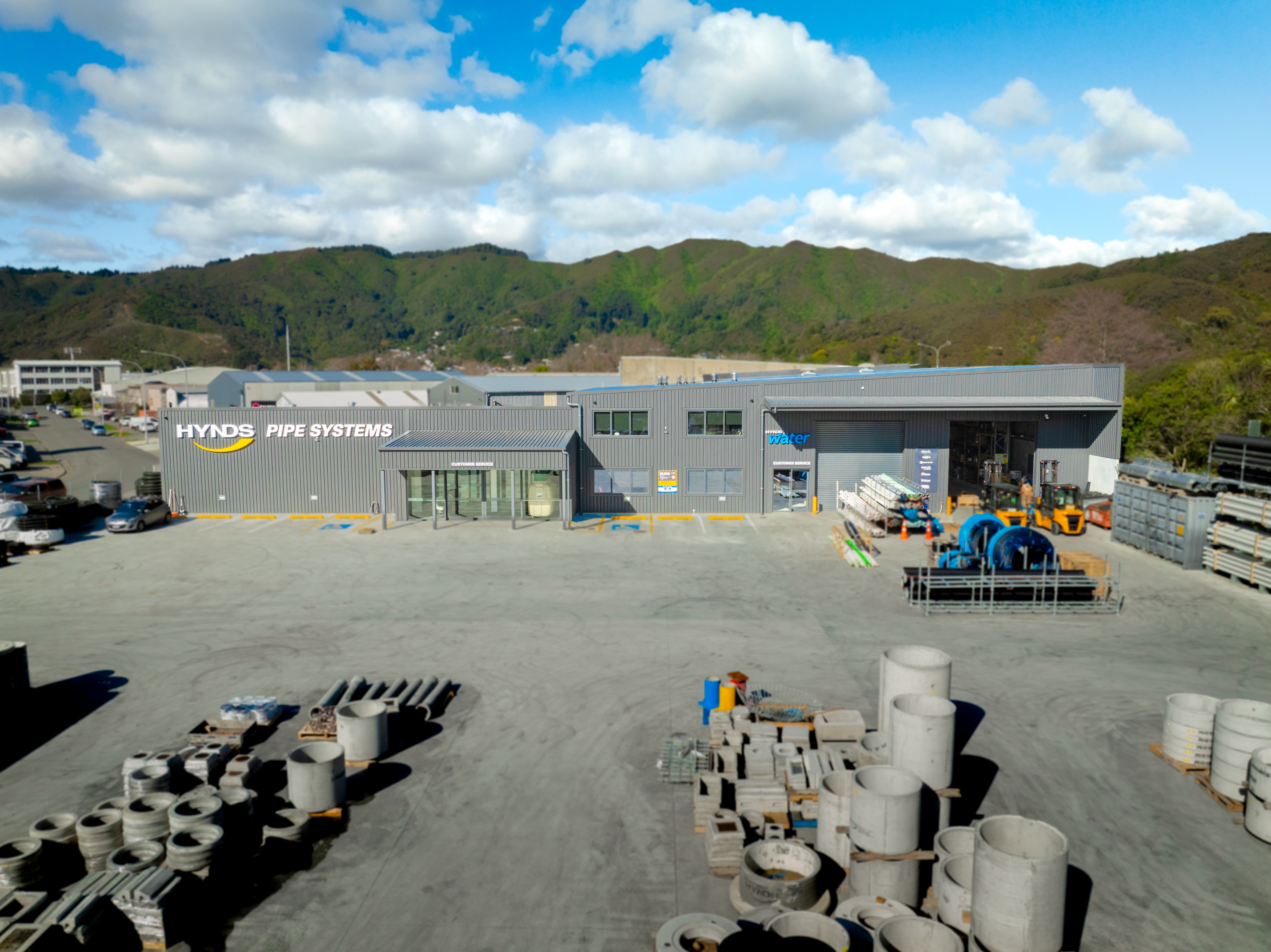 Hynds Pipe Systems branch, Lower Hutt, front elevation with the Tararua foothills behind