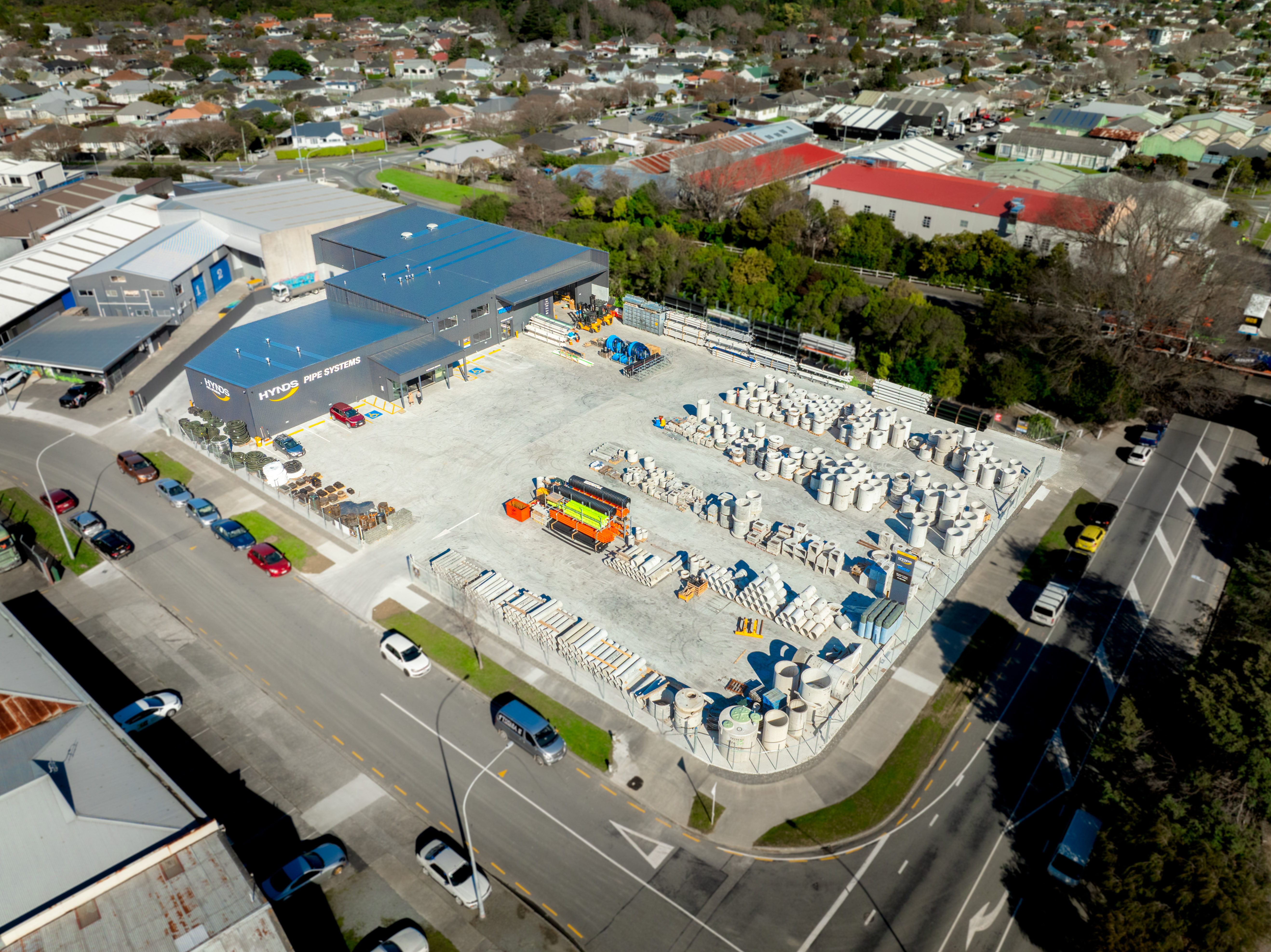Wide aerial of the finished Hynds Pipe Systems branch and full yard