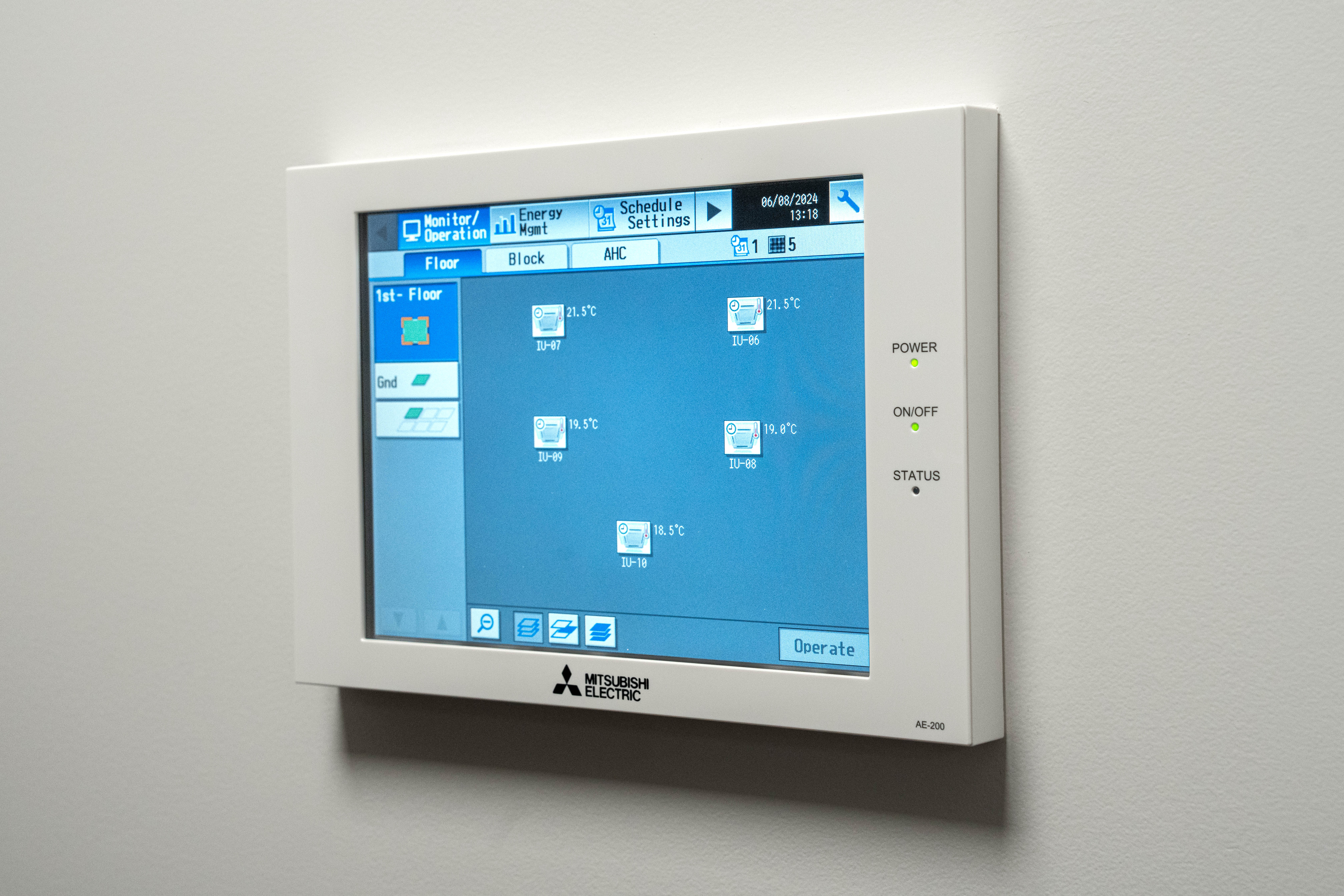 Wall-mounted Mitsubishi Electric AE-200 centralised controller