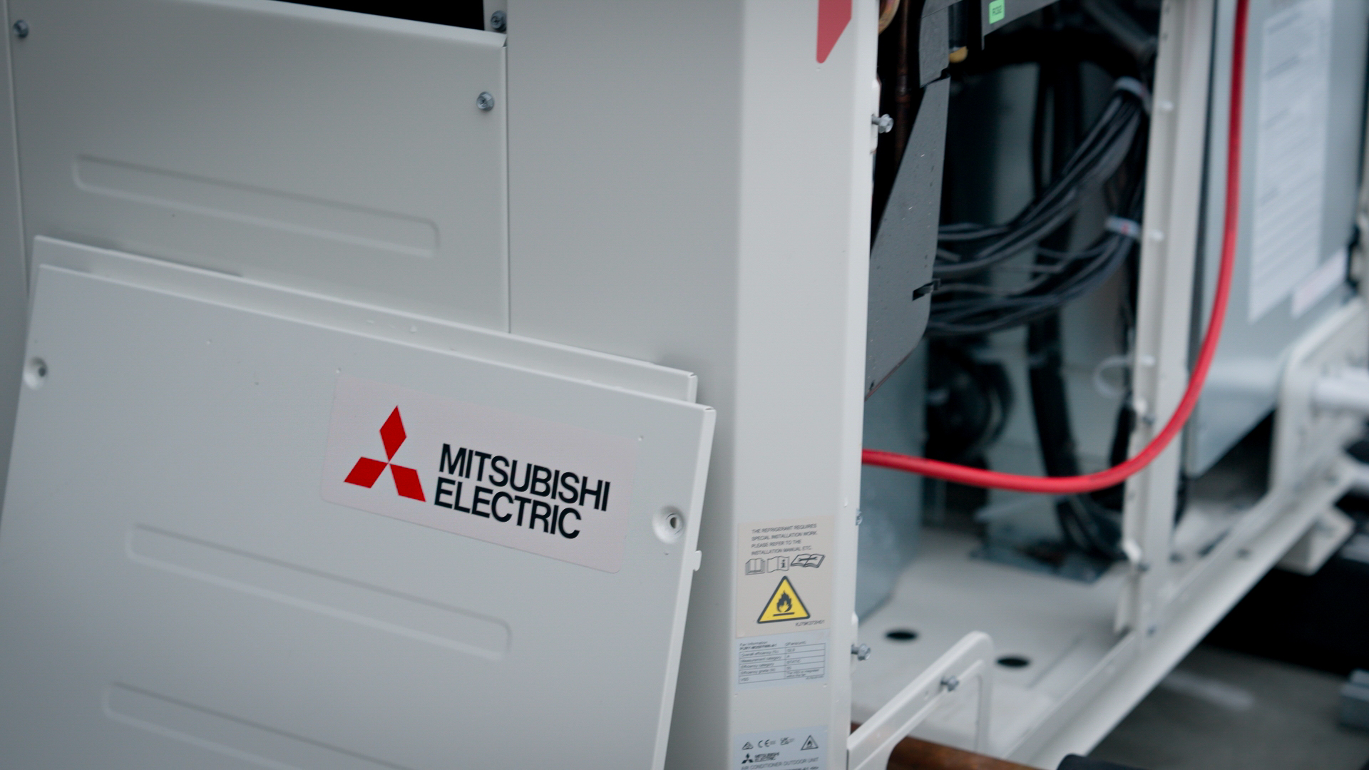 Mitsubishi Electric badge on the R32 outdoor unit