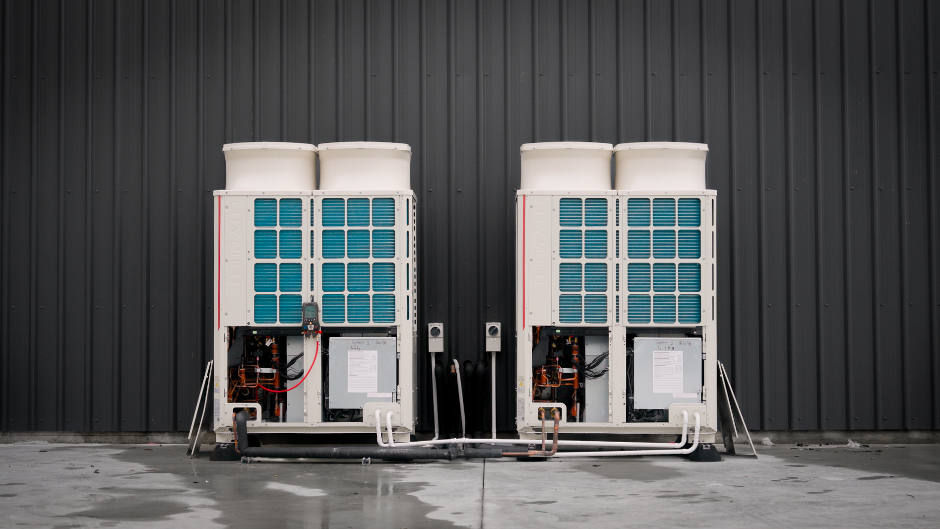 Two Mitsubishi Electric R32 City Multi outdoor condensing units
