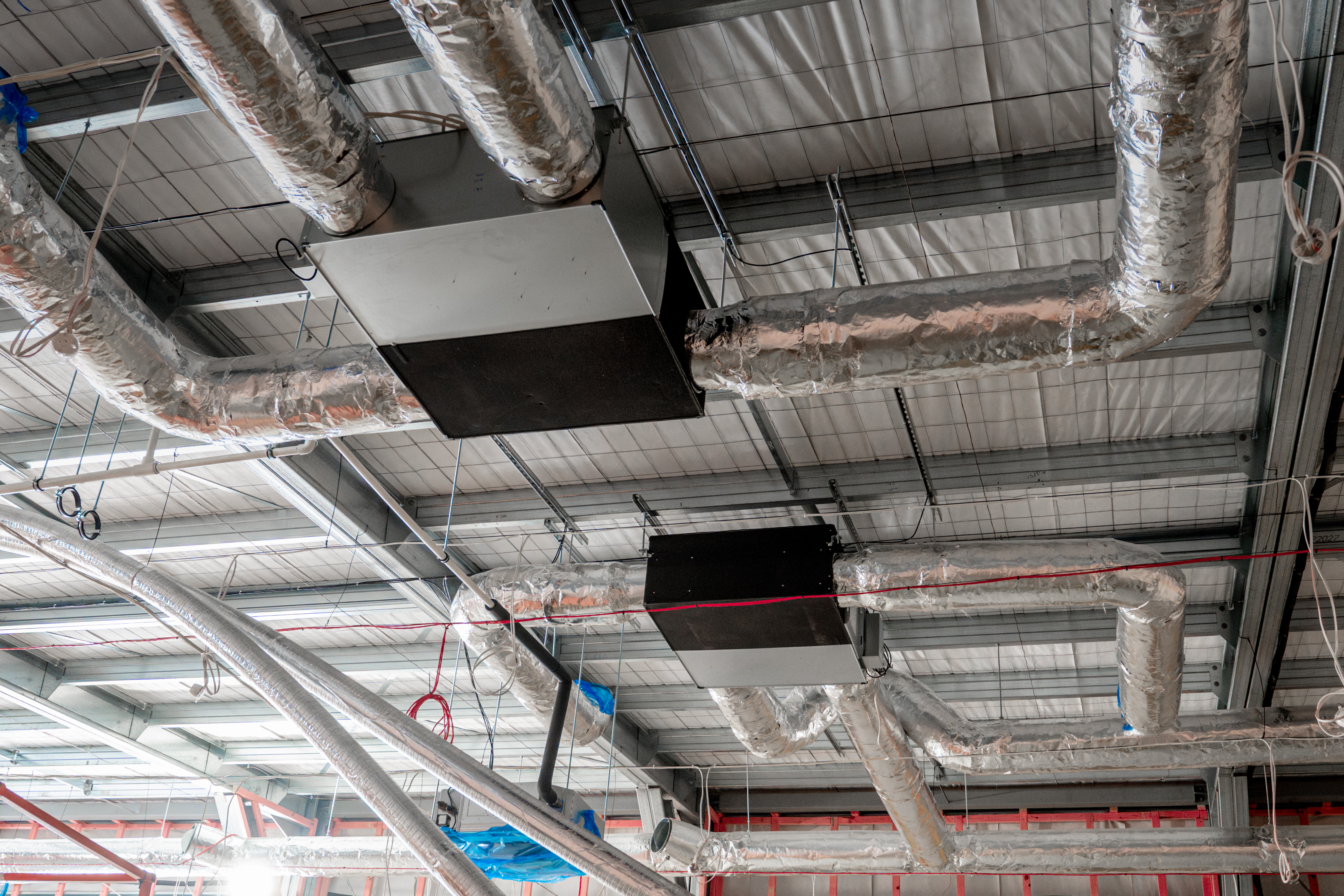Insulated supply ductwork and ducted indoor units at high level