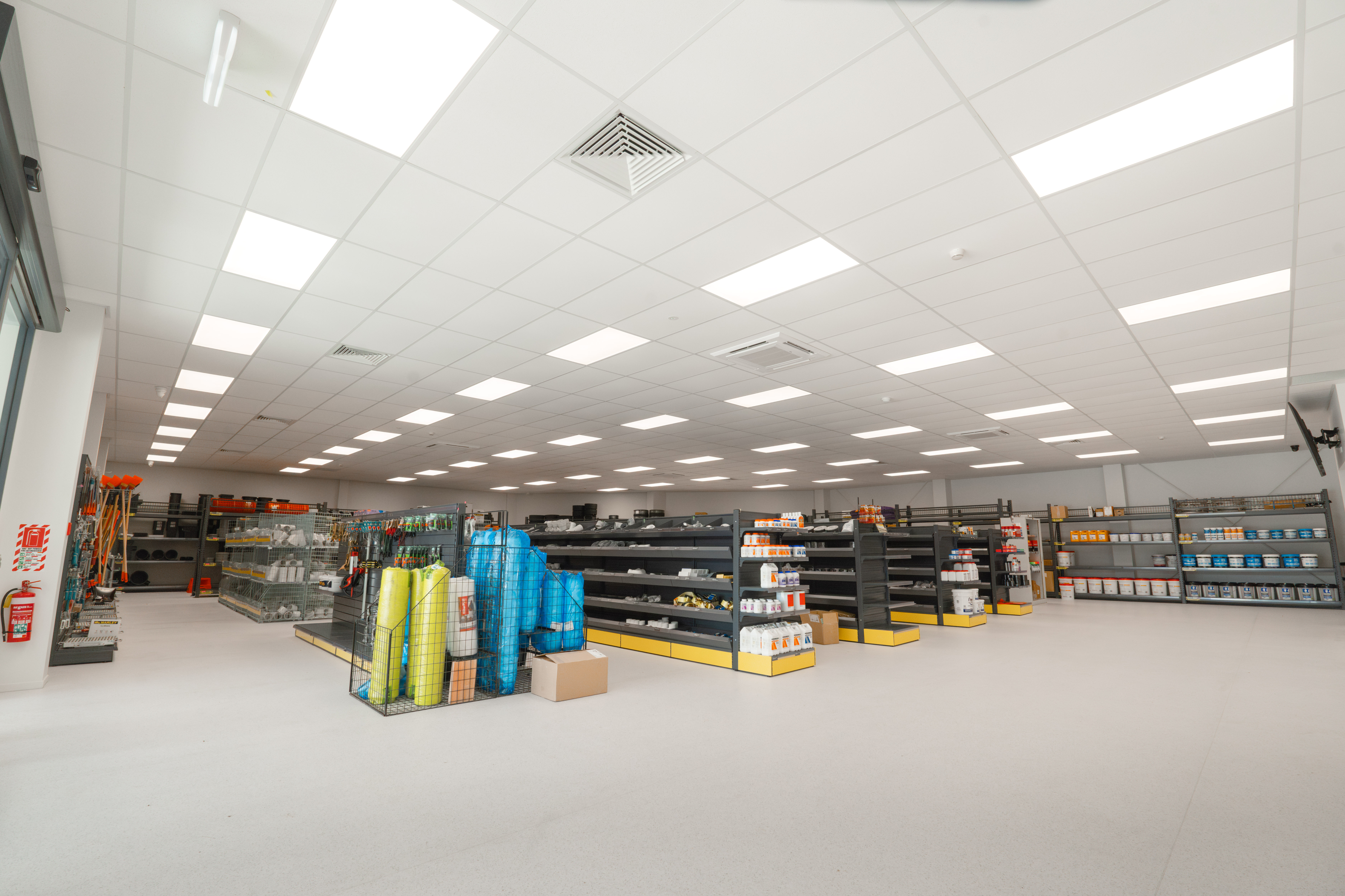 Bright, evenly-lit trade store interior with product shelving